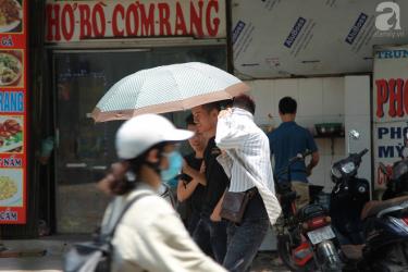 Muôn kiểu 'chống nắng nóng' của người Hà Nội trong những ngày đầu hè